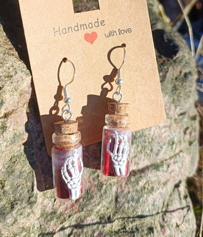 Skeletal Hand & Bottle Earrings